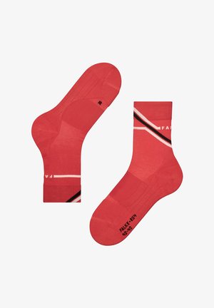 Red socks with a textured design, featuring white and black diagonal stripes. Marked with size and branding on the sole.