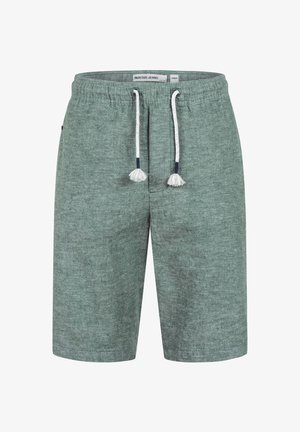 Shorts en tissu vert texturé avec ceinture élastique et cordons blancs à pompons, taille moyenne étiquetée, de la marque Indicode Jeans.
