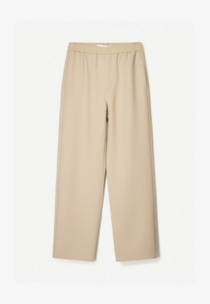 Beige wijde broek met een elastische tailleband, gemaakt van zachte stof, met een gladde textuur en minimale stikdetails.