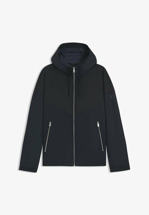 Black hooded jacket with a contrasting geometric design, featuring a zip closure and two side pockets with silver zippers. Smooth fabric texture.