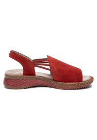 Red suede open-toe sandal with elastic side straps, cushioned insole, and textured low wedge sole for casual wear.