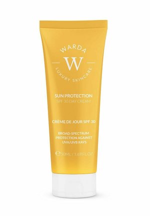 Żółta tubka Warda Luxury Skincare SPF 30, krem przeciwsłoneczny na dzień z szerokospektralną ochroną UVA/UVB, 50 ml.