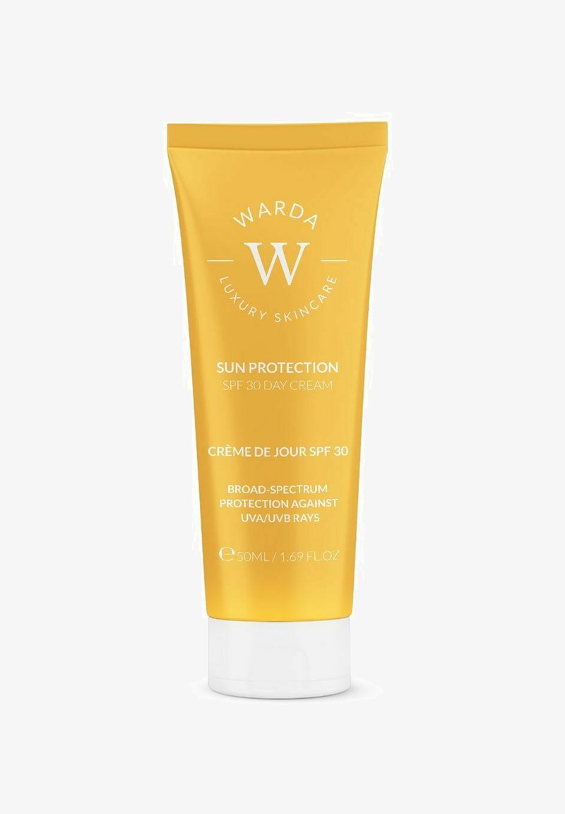 Żółta tubka Warda Luxury Skincare SPF 30, krem przeciwsłoneczny na dzień z szerokospektralną ochroną UVA/UVB, 50 ml.