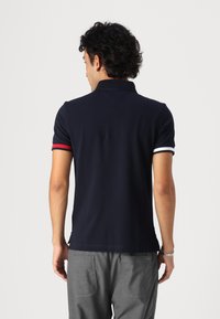 Tommy Hilfiger FLAG CUFF SLIM - Polo - desert sky