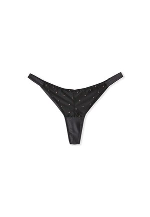 Black thong made of satin, featuring a smooth texture and small, metallic dot embellishments across the front. Adjustable straps.
