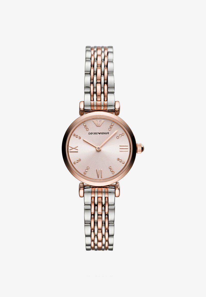 Armbåndsur i rosaguld og sølv metal med rund pink urskive, krystal-timemarkører og romertal ved 3, 6 og 9.