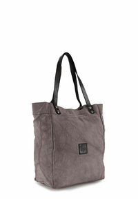 Grijze canvas draagtas met zwarte leren handvatten, voorzien van een gestikt ontwerp en een klein zwart logovignet aan de voorkant.