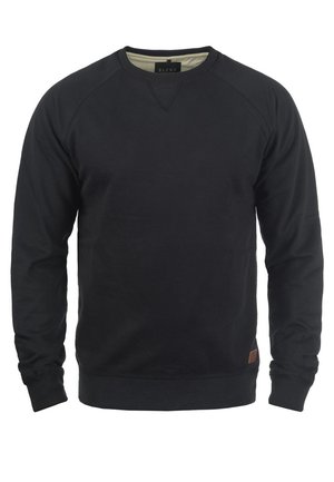 Musta pyöreäkaula-aukollinen collegepaita, joka on valmistettu puuvillasta ja jossa on raglan-hihat sekä teksturoitu, sileä pinta. Sisältää pienen ruskean brändättyä merkinnän.