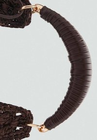Brown woven bag handle featuring a curved shape, textured grip, and gold-tone hardware accents at each attachment point.