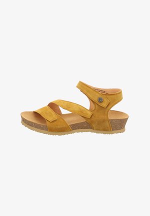 Gelbe Wildleder-Sandalette mit zwei verstellbaren Riemen, gepolstertem Fußbett und Korkkeilsohle. Mit einem dekorativen Metallelement.
