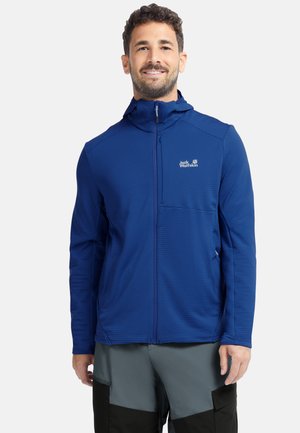 Blaue synthetische Jacke mit Reißverschluss vorne, Kapuze, strukturierter Oberfläche und Logo auf der Brust. Verfügt über eine Brusttasche und einen lässigen Schnitt.