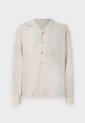 Long-sleeved, button-up shirt with a light cream and tan vertical stripe pattern. Made of textured fabric, featuring a classic collar and chest pocket.