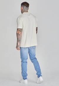SIKSILK DROP CROTCH - Jeans Tapered Fit - light blue