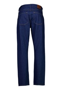 Σκούρο μπλε τζιν με ίσια γραμμή, αντίθετη χρυσή ραφή, δύο πίσω τσέπες και καφέ δερμάτινη ετικέτα στη μέση.