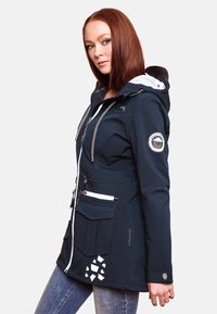 Navy waterproof jacket with a zip front, contrast white detailing, multiple pockets, and a decorative geometric pattern near the hem.