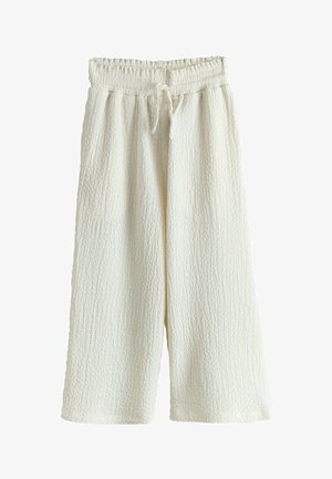 Pantaloni evazați, de culoare crem, dintr-un material texturat, cu talie elastică și șnur de strângere în față.