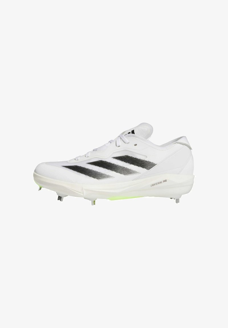 White athletic shoe with black stripes and mesh design. Features a lightweight structure, molded spikes, and a green accent on the outsole.