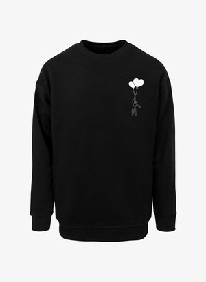 Sweat-shirt noir à col rond, avec un motif brodé blanc représentant une personne tenant deux ballons en forme de cœur sur le côté gauche.