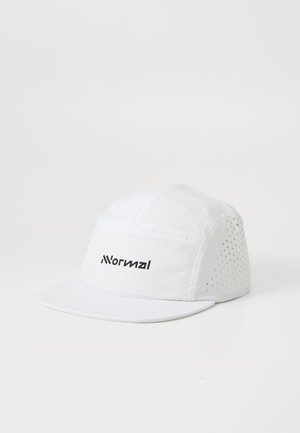 White cap made of lightweight fabric with a flat brim. Features a logo on the front and perforated accents on the sides for ventilation.
