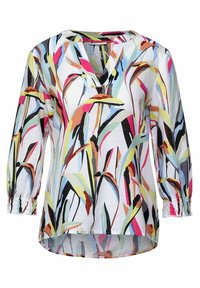 Blouse légère et colorée avec un motif floral. Présente un col en V, des manches 3/4 avec des poignets élastiques et un ourlet court devant et long derrière.