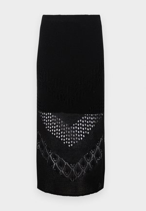 Saia preta de malha com um design texturizado e padrões variados, incluindo tramas abertas e seções sólidas, que chega logo acima dos joelhos.