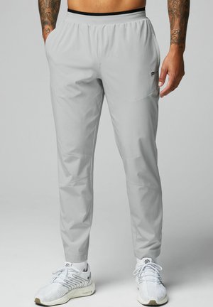 THE FUNDAMENTAL - Tracksuit bottoms - grau