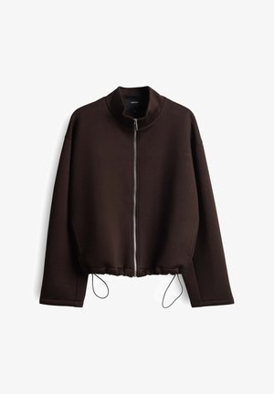 Braune, taillierte Jacke aus weichem Material, mit hohen Kragen, Vorderreißverschluss und verstellbarem Kordelzug am Saum. Leicht oversized Schnitt.