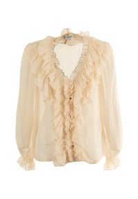 Blusa de color crema con fruncidos en el frente, mangas largas transparentes y escote en V. Hecha de un tejido ligero con una textura sutil.