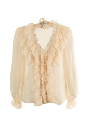 Blusa color crema con fronte arricciato, maniche lunghe trasparenti e scollatura a V. Realizzata in un tessuto leggero con una leggera texture.