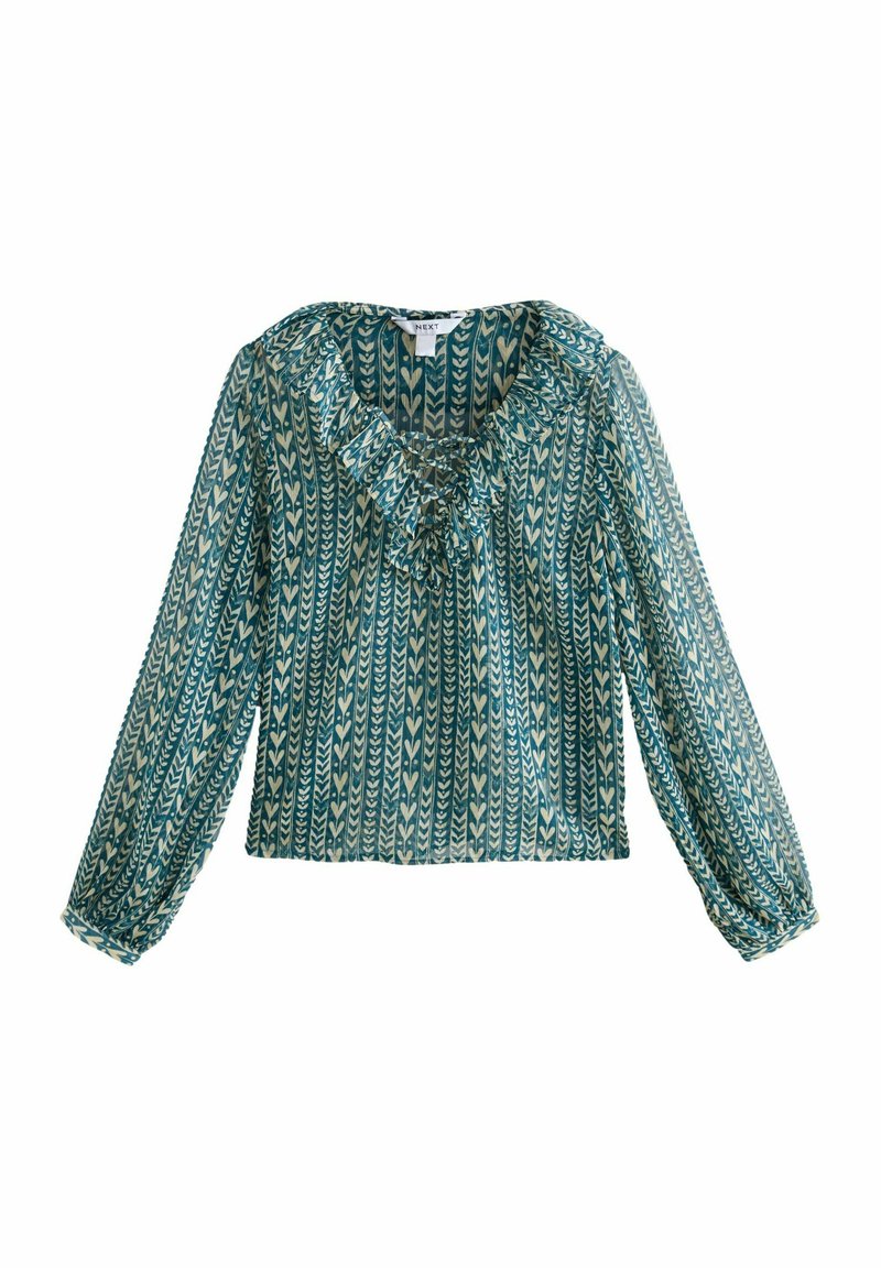 Blouse à manches longues en teal avec des motifs géométriques crème. Présente un col froncé et un détail de boutons, fabriquée en tissu léger et transparent.