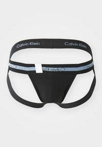Schwarze Shorts mit einem elastischen Bund und blau-weißer Calvin Klein-Logo. Glattes Material, minimalistische Schnittführung und verstellbare Träger.