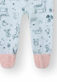 Legging de algodón gris claro con diseños caprichosos impresos en gris oscuro, con puños de felpa rosa en el tobillo.