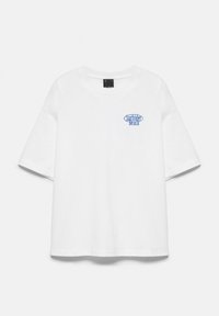 White short-sleeve T-shirt with blue "Sunrider Beach" text on the left chest and a black label inside the collar.