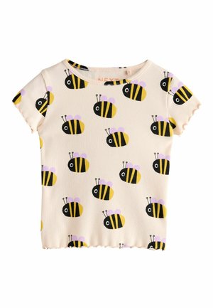 Short-sleeve shirt in ribbed fabric featuring a beige background with black and yellow bee patterns and lilac accents. Scalloped hem.