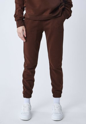 ESSENTIALS - Pantalones deportivos - marron