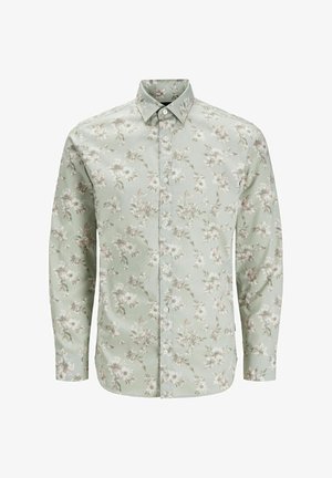 Ziedu garām piedurknēm krekls gaiši zaļā krāsā, ar pogām aizdaru un mīksto rozā ziedu un lapu rakstu uz gludas auduma.