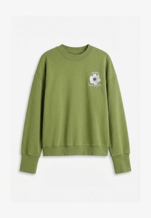 Bluză olive cu gât rotund, cu mâneci lungi și floare albă brodată, împreună cu un text pe partea stângă a pieptului.