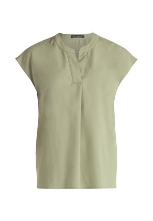 Helles grünes Blusenshirt mit Rundhalsausschnitt, kurzen Ärmeln und einem dezenten vertikalen Fältchen an der Vorderseite. Glatte Stoffqualität und lockere Passform.