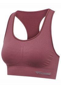 Bezszwowy sportowy biustonosz typu racerback w kolorze mauve z subtelnym teksturowanym wzorem i logo „hummel” na dolnej gumce.