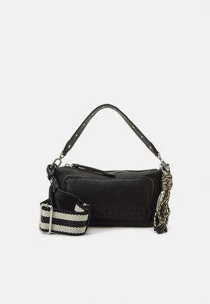 Black rectangular handbag with top zipper, short handle, striped detachable shoulder strap, and multi-colored braided accessory on side.
