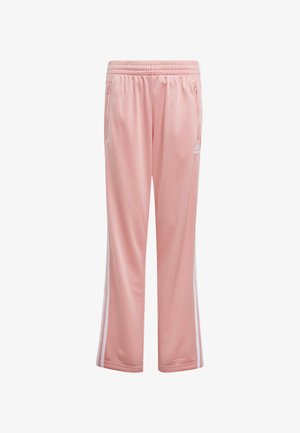Pink athletic pants with a smooth texture, elastic waistband, two side pockets, and white side stripes, featuring a small logo on the hip.