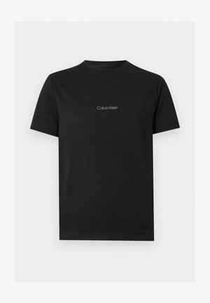 Schwarzes T-Shirt mit kurzen Ärmeln und Rundhalsausschnitt mit kleinem grauen "Calvin Klein"-Logo auf der Brustmitte.