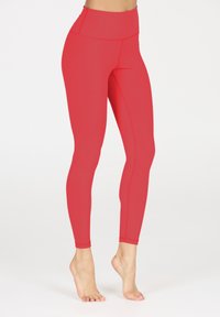 Rode high-waisted leggings van een soepele, rekbare stof. Heeft een aansluitend ontwerp en vlakke naden voor comfort en duurzaamheid.