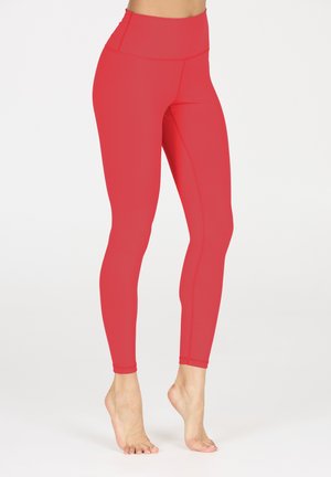Rode high-waisted leggings van een soepele, rekbare stof. Heeft een aansluitend ontwerp en vlakke naden voor comfort en duurzaamheid.