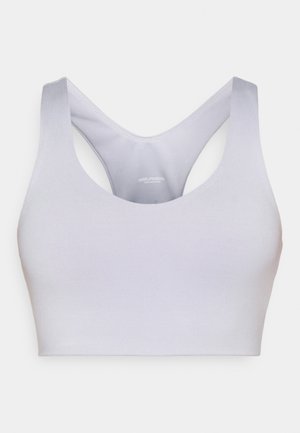 Light gray sports bra with a smooth, stretchy fabric. Features a rounded neckline and wide, racerback straps for support.