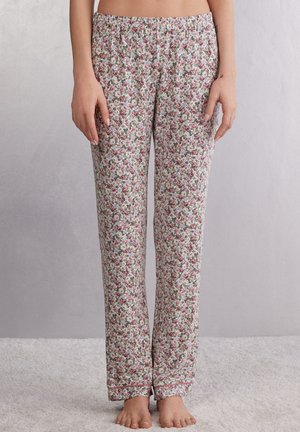 Bloemige pyjamabroek met een witte basis, voorzien van kleine roze en groene rozenpatronen, een elastische tailleband en contrasterende rand aan de zoom.