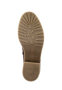 Brown rubber shoe sole with a textured pattern featuring horizontal and triangular designs, labeled with "remonte" and size "37."