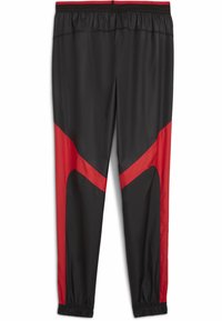 Svart trening bukser med røde detaljer, med elastisk midjebånd og smalnede strømper. Laget av glatt, lett materiale med sporty design.
