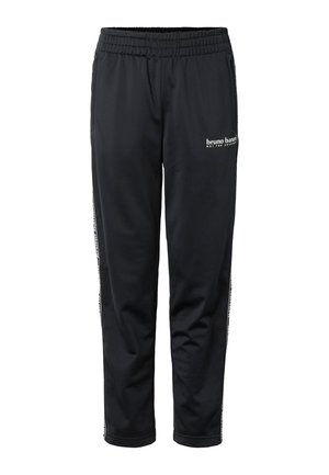 Zwarte sportbroek met elastische tailleband, zijzakken, wit logo "bruno banani" op de rechterdij en merkstrepen langs de pijpen.