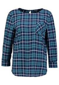 Navy and teal checkered blouse with long sleeves, a round neck, a keyhole back, and a front pocket. Made from soft, lightweight fabric.
